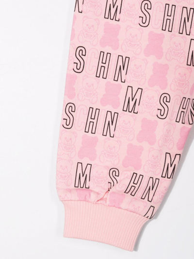 Shop Moschino All-over Logo-print Trousers In Pink