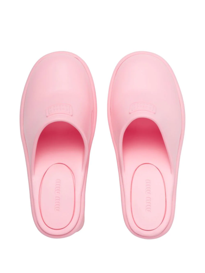 Shop Miu Miu Embossed Logo Mules In Pink