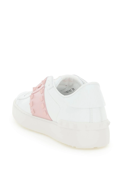 Shop Valentino Rockstud Untitled Sneakers In White,pink