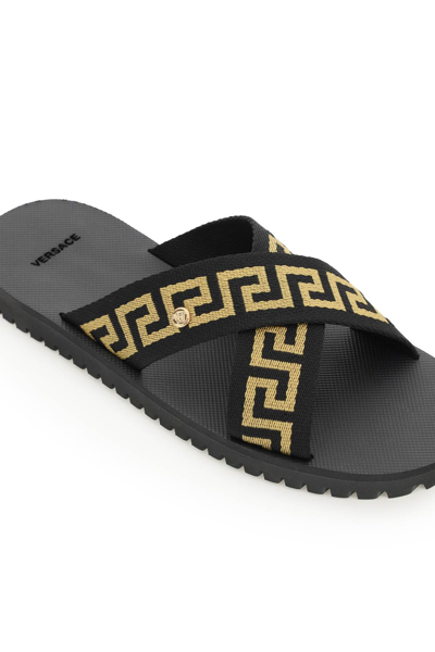 Shop Versace Criss-crossed Greca Ribbon Sandals In Black,gold