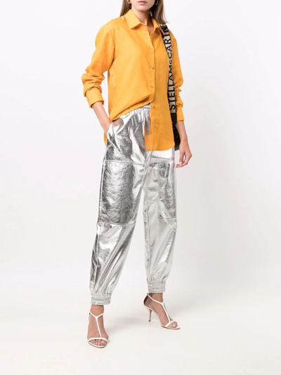 Shop Stella Mccartney Metallic Tapered Track Pants In Silver