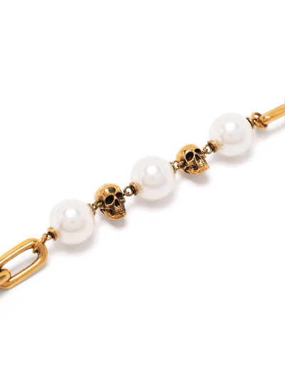 Shop Alexander Mcqueen Pearl-embellished Skull Bracelet In Gold