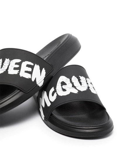 Shop Alexander Mcqueen Graffiti-logo Slip-on Slides In Schwarz