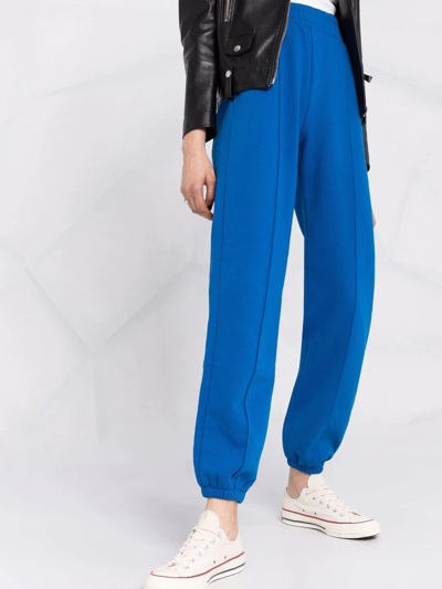 Shop Tommy Hilfiger Logo-patch Straight-leg Track Pants In Blue