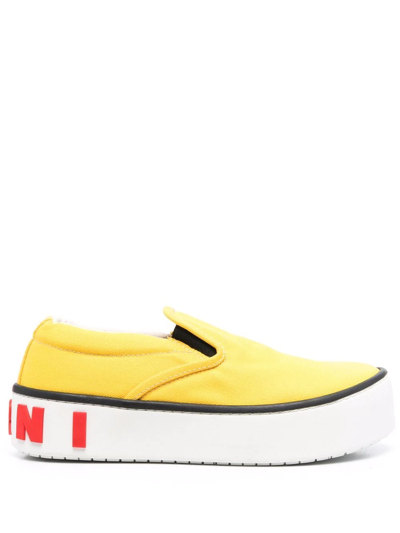 Shop Marni Raised Logo Slip-on Sneakers In Yellow
