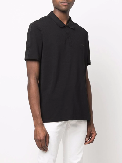 Shop Calvin Klein Logo-print Polo Shirt In Black