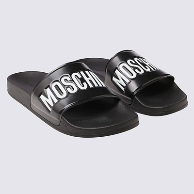 Shop Moschino Black Slides