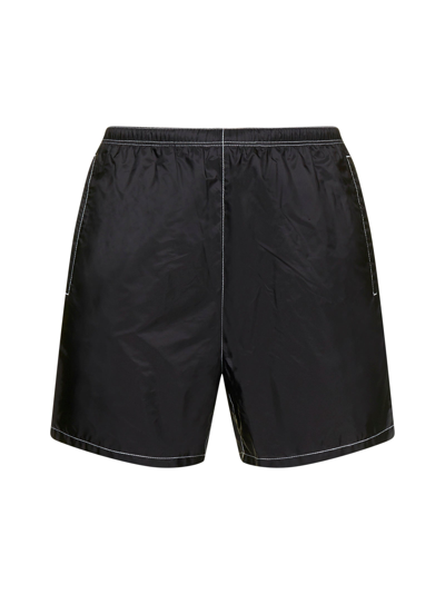 Shop Prada Logo Plaque Swim Shorts In Black