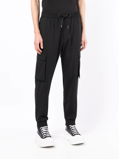 Shop Juunj Relaxed Wool-blend Track Pants In Schwarz