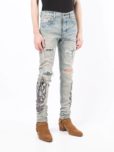 Shop Amiri Paisley-print Ripped Skinny Jeans In Blau