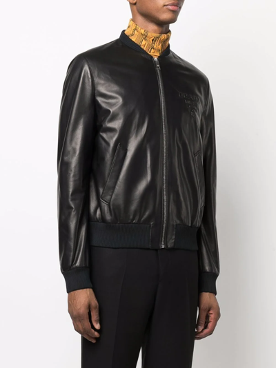 Shop Prada Logo Debossed Leather Bomber Jacket In Schwarz