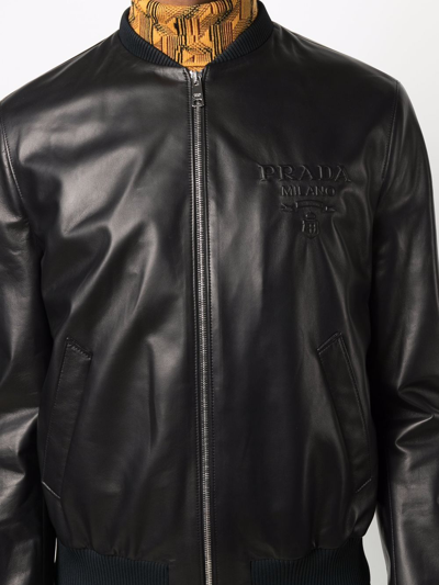 Shop Prada Logo Debossed Leather Bomber Jacket In Schwarz