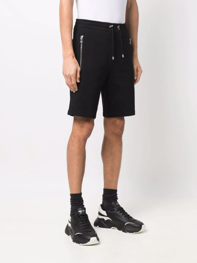 Shop Balmain Embossed-logo Bermuda Shorts In Black