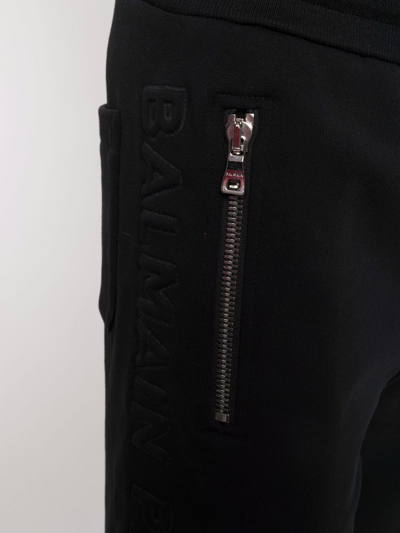 Shop Balmain Embossed-logo Bermuda Shorts In Black