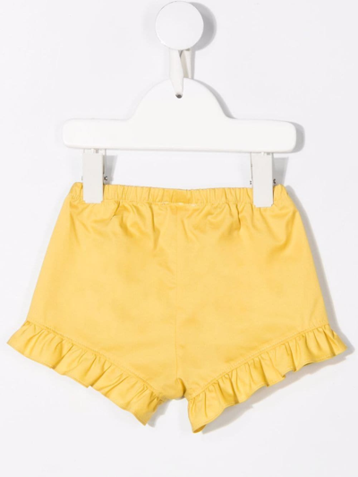 Shop Il Gufo Ruffled Hem Cotton Shorts In Yellow