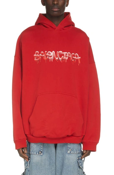 Shop Balenciaga Wide Fit Graffiti Logo Graphic Hoodie In Cardi Red/ Cardi Red