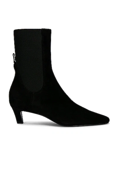 Shop Totême The Mid Heel Boot In Black