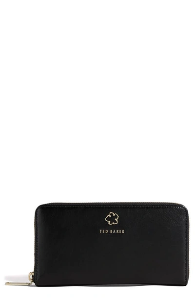 Shop Ted Baker Jorjana Flower Eyelet Large Leather Zip Wallet In Black