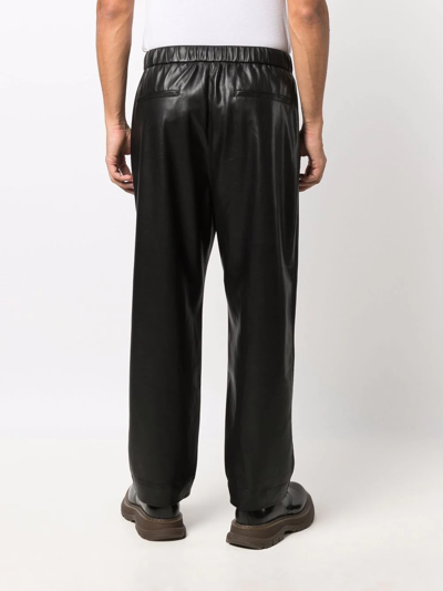 Shop Nanushka Straight-leg Vegan Leather Trousers In Black