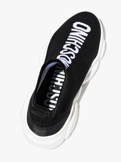 Shop Moschino Teddy Sole Logo Sneakers In Black