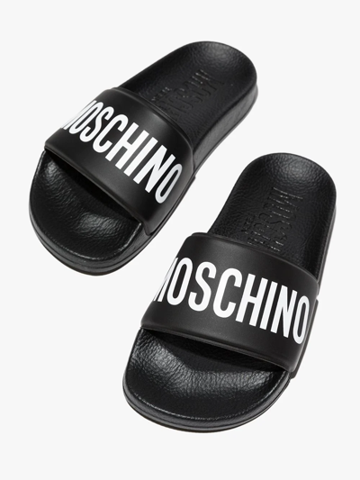 Shop Moschino Logo-print Flat Slides In Black