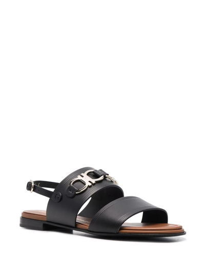 Shop Ferragamo Gancini Plaque Sandals In Black