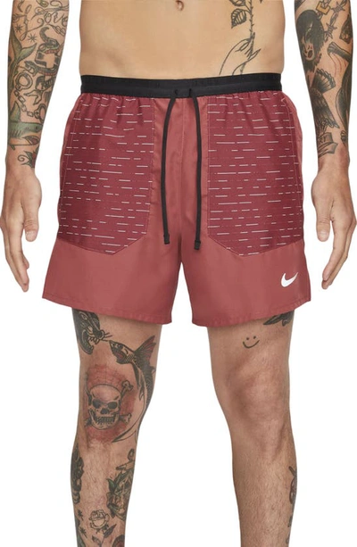 Shop Nike Frame Pleated Belted Leather Shorts In Cedar