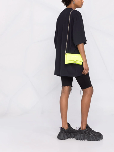 Shop Balenciaga Hourglass Wallet Crossbody Bag In Yellow