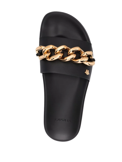 Shop Versace Chain-embellished Flat Slides In Schwarz
