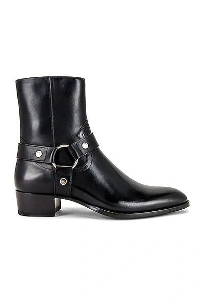 Shop Saint Laurent Wyatt Harness Boot In Noir
