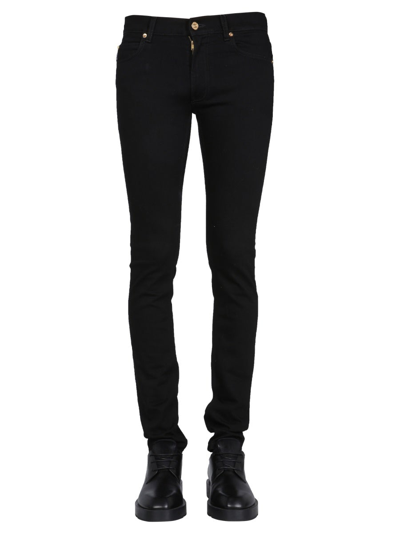 Shop Versace Logo Patch Buttoned Skinny Jeans In Black