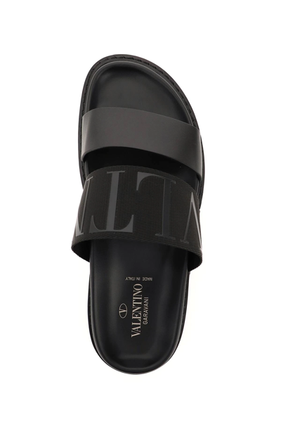 Shop Valentino Vltn Webbing Slides In Black