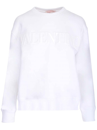 Shop Valentino Logo Embossed Jersey Sweatshirt In White