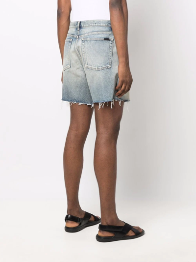 Shop Saint Laurent Raw-edge Cotton Denim Shorts In Blau