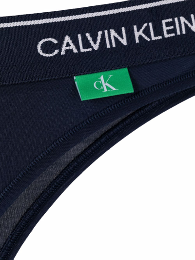 Shop Calvin Klein Logo Waistband Brazilian Thong In Blue