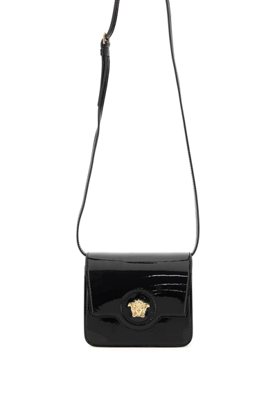 Shop Versace La Medusa Crossbody Bag In Nero Oro  (black)