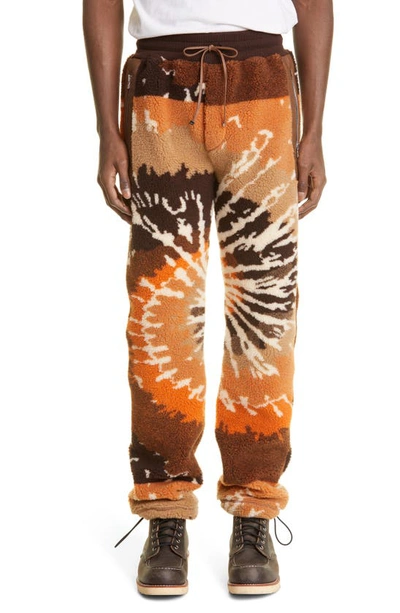 Shop Amiri Tie Dye Fleece Track Pants In Orange/ Black