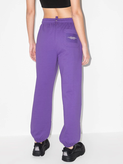 Shop Marc Jacobs Logo Print Loose-fit Track Pants In Purple