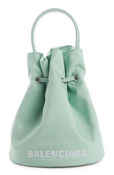 Balenciaga Beige XS Wheel Drawstring Bucket Bag - Realry: A global fashion  sites aggregator