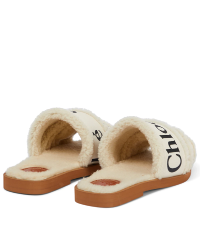 Shop Chloé Woody Shearling-lined Canvas Slides In White
