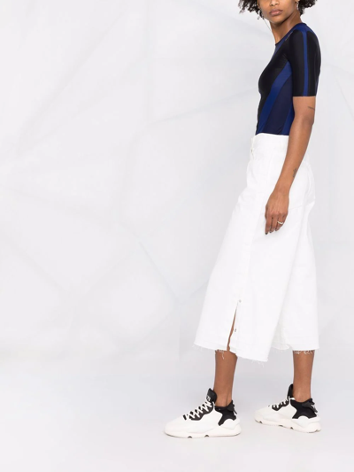Shop Sacai Mid-rise Wide-leg Jeans In White