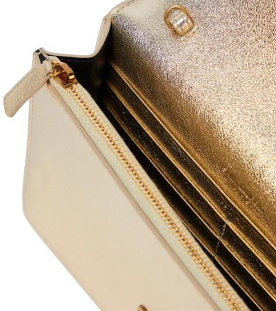 CASSANDRE Envelope chain wallet in metallized leather