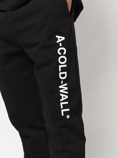 Shop A-cold-wall* Logo-print Tapered Joggers In Schwarz