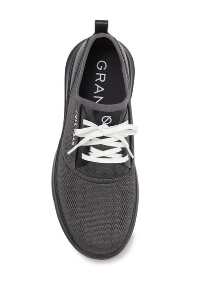 Shop Cole Haan Grandsport Journey Knit Sneaker In Black Magnet Optic White