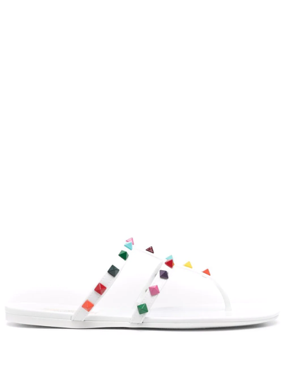 Shop Valentino Rockstud Thong Flat Sandals In White