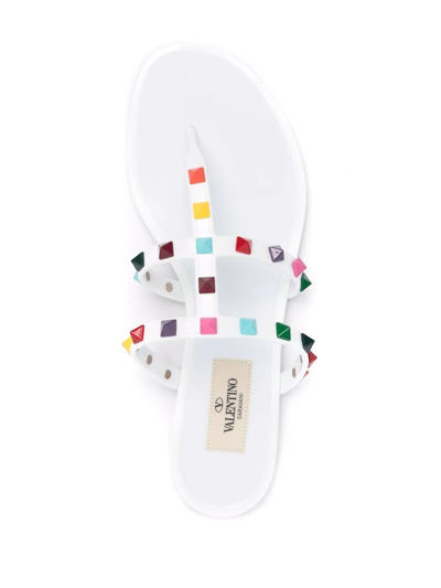 Shop Valentino Rockstud Thong Flat Sandals In White