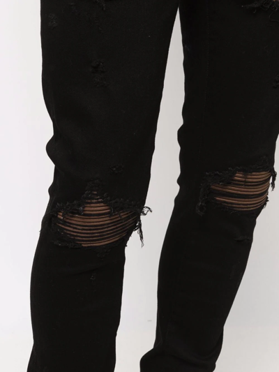 Shop Amiri Ripped-finish Skinny Jeans In Black
