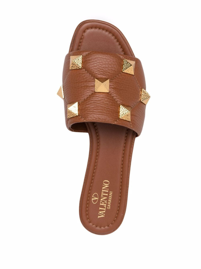 Shop Valentino Roman Stud Flat Sandals In Brown