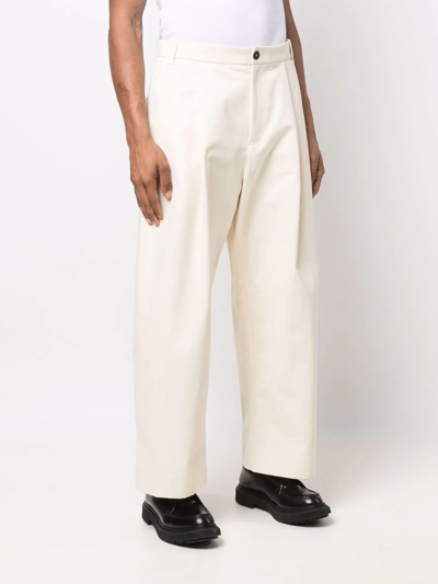 Studio Nicholson Sorte Wide-leg Pleated Trousers In Nude