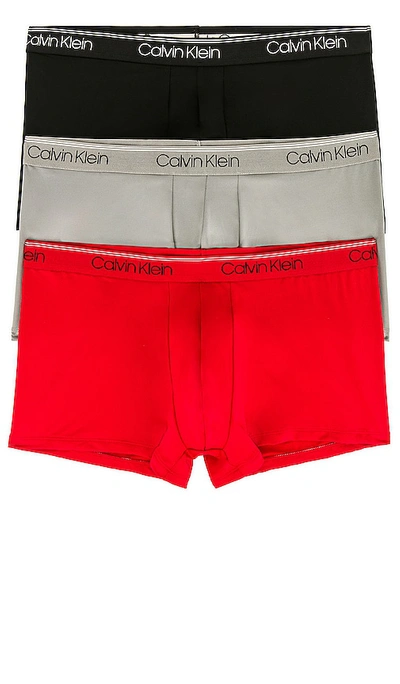 Shop Calvin Klein Underwear Calvin Klein Low Rise Trunk 3 Piece Set In Black  Convoy  & Red Gala